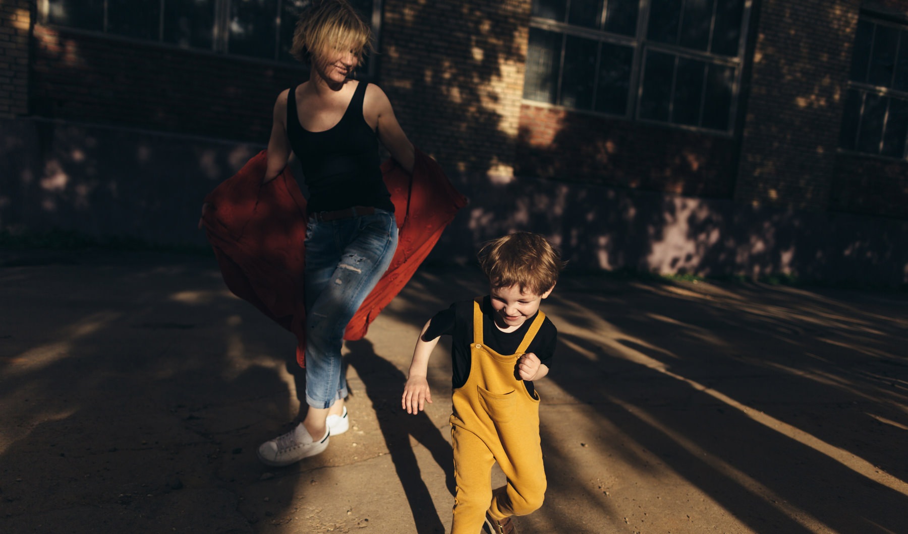 woman and kid running in the dark