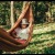 a person in a hammock reading a book